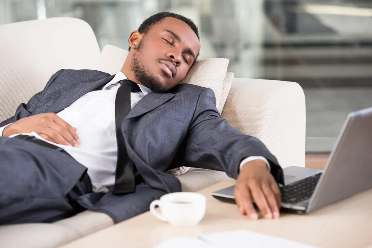 Coffee Nap - Man sleeping on couch