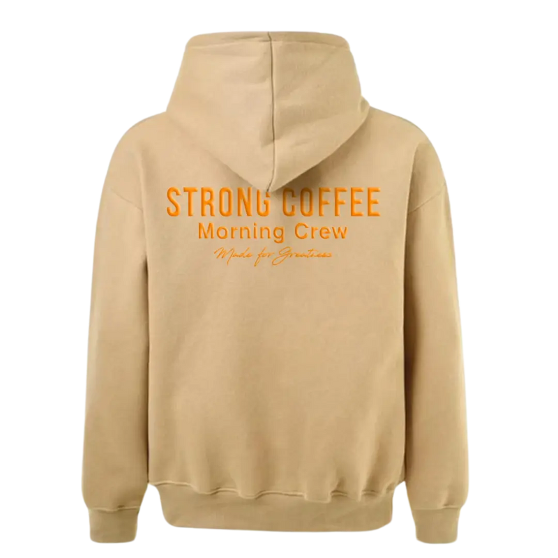 A beige hoodie with the text 'STRONG COFFEE Morning Crew' printed on the back.