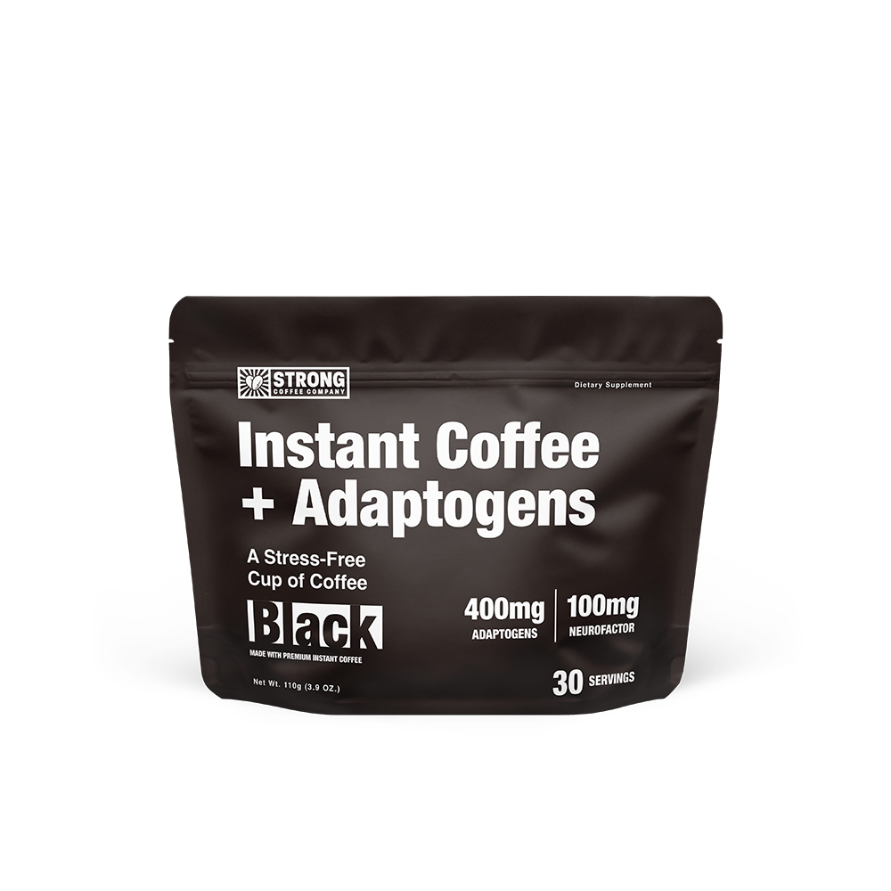 A package of BLACK Instant Coffee + Adaptogens by STRONG COFFEE COMPANY with text detailing the product as a stress-free cup, containing adaptogens, and providing 30 servings.