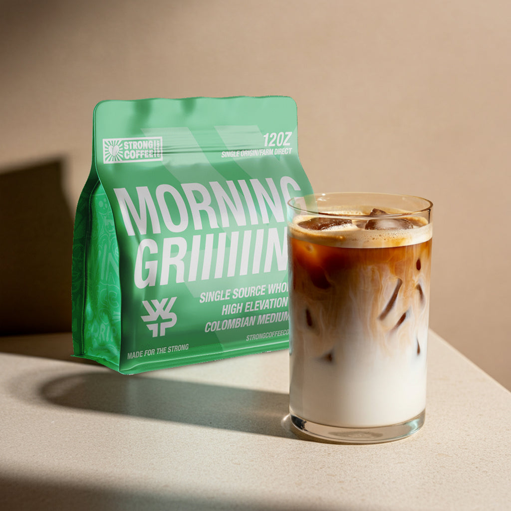 Green coffee bag labeled 'Morning Grrrinn' next to a glass of iced coffee on a neutral background