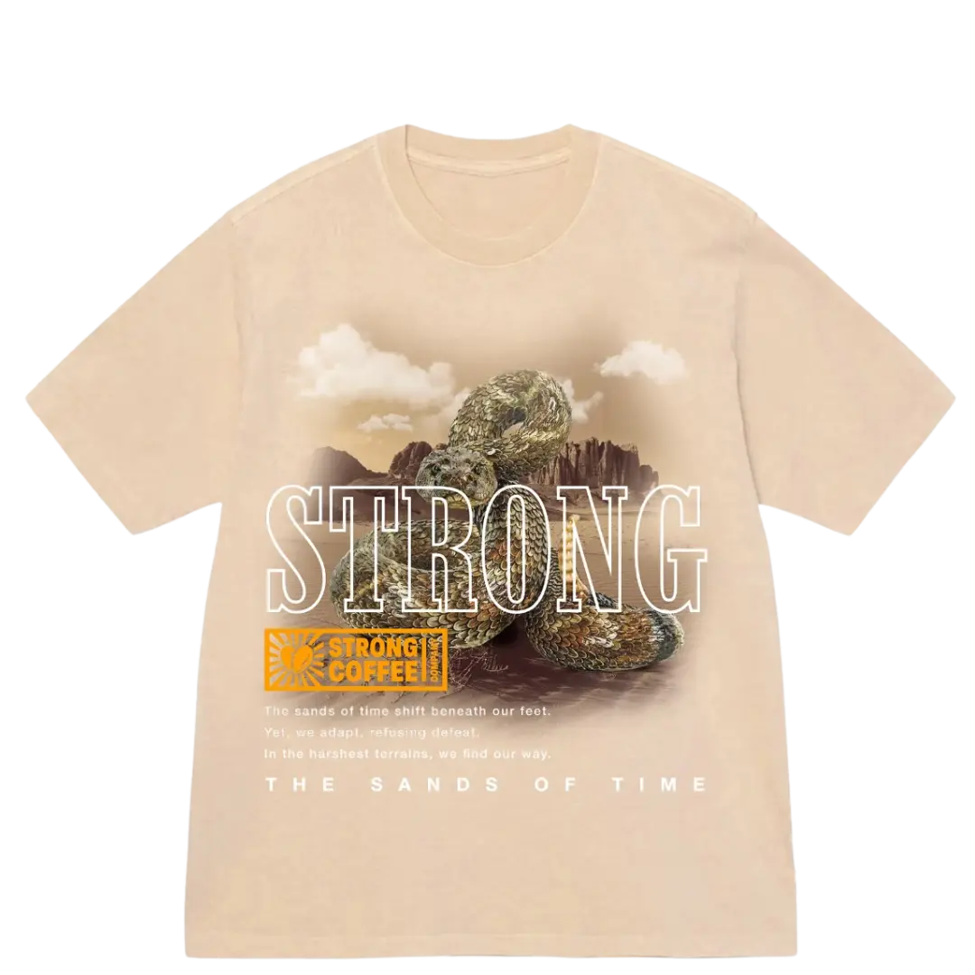 A beige t-shirt with a graphic print of a rattlesnake and the words 'STRONG' and 'THE SANDS OF TIME'.