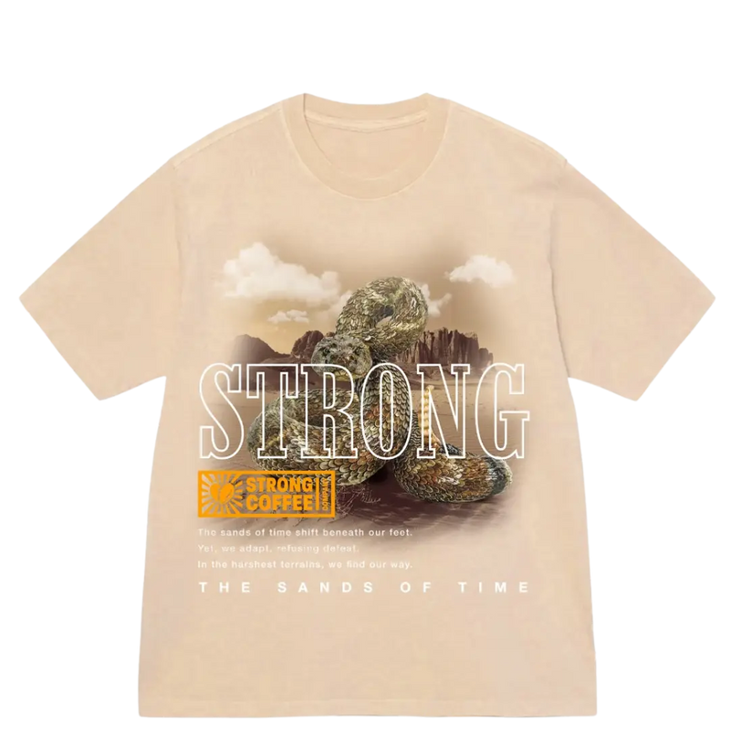 A beige t-shirt with a graphic print of a rattlesnake and the words 'STRONG' and 'THE SANDS OF TIME'.